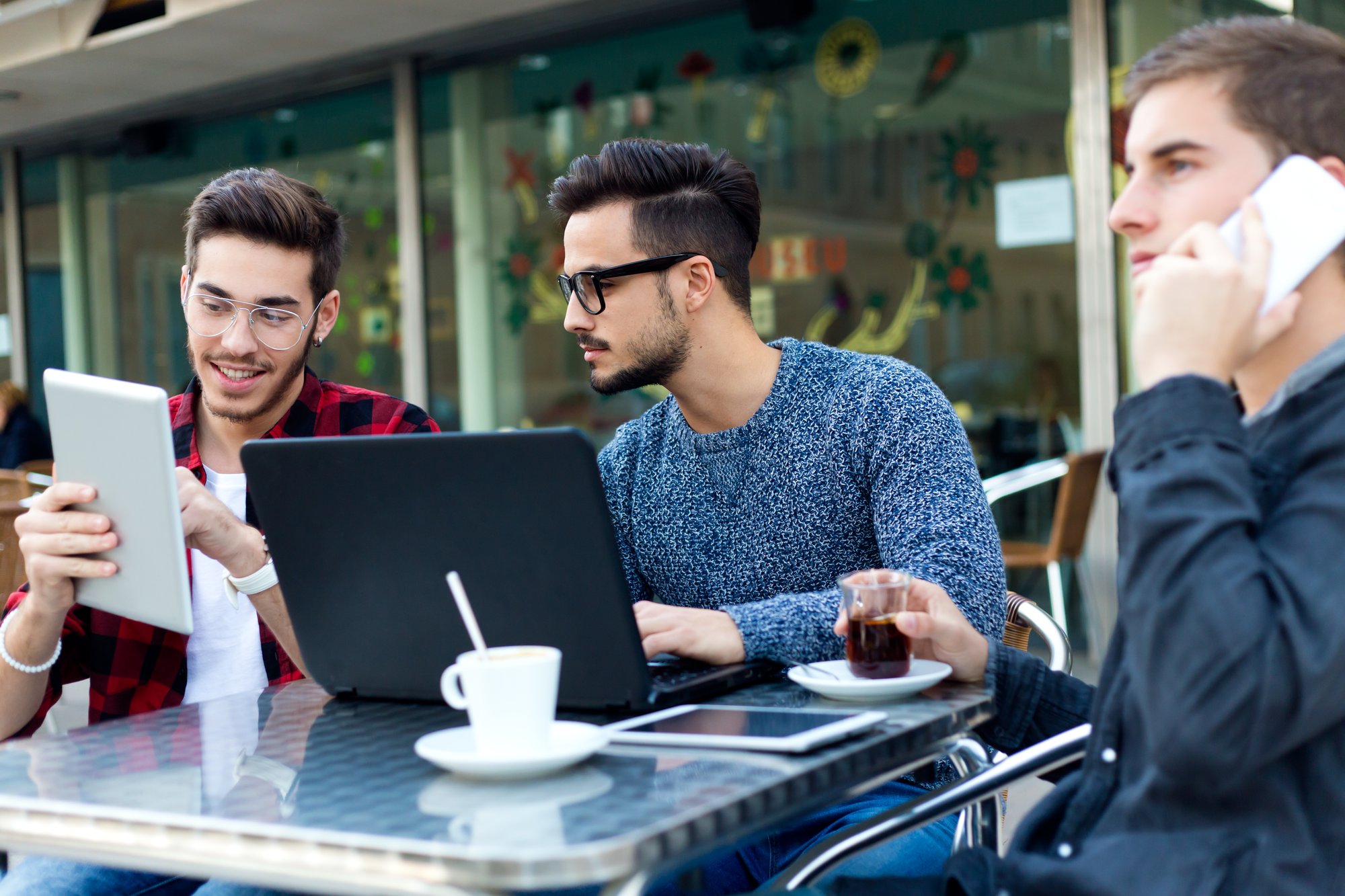 outdoor-portrait-young-entrepreneurs-working-coffee-bar